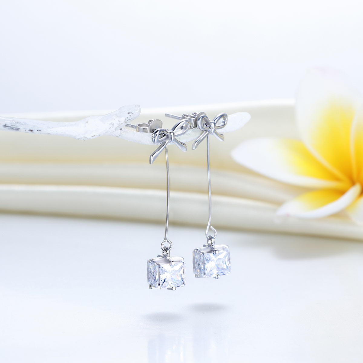 925 Sterling Silver Bowknot Created Diamond Dangle Earrings